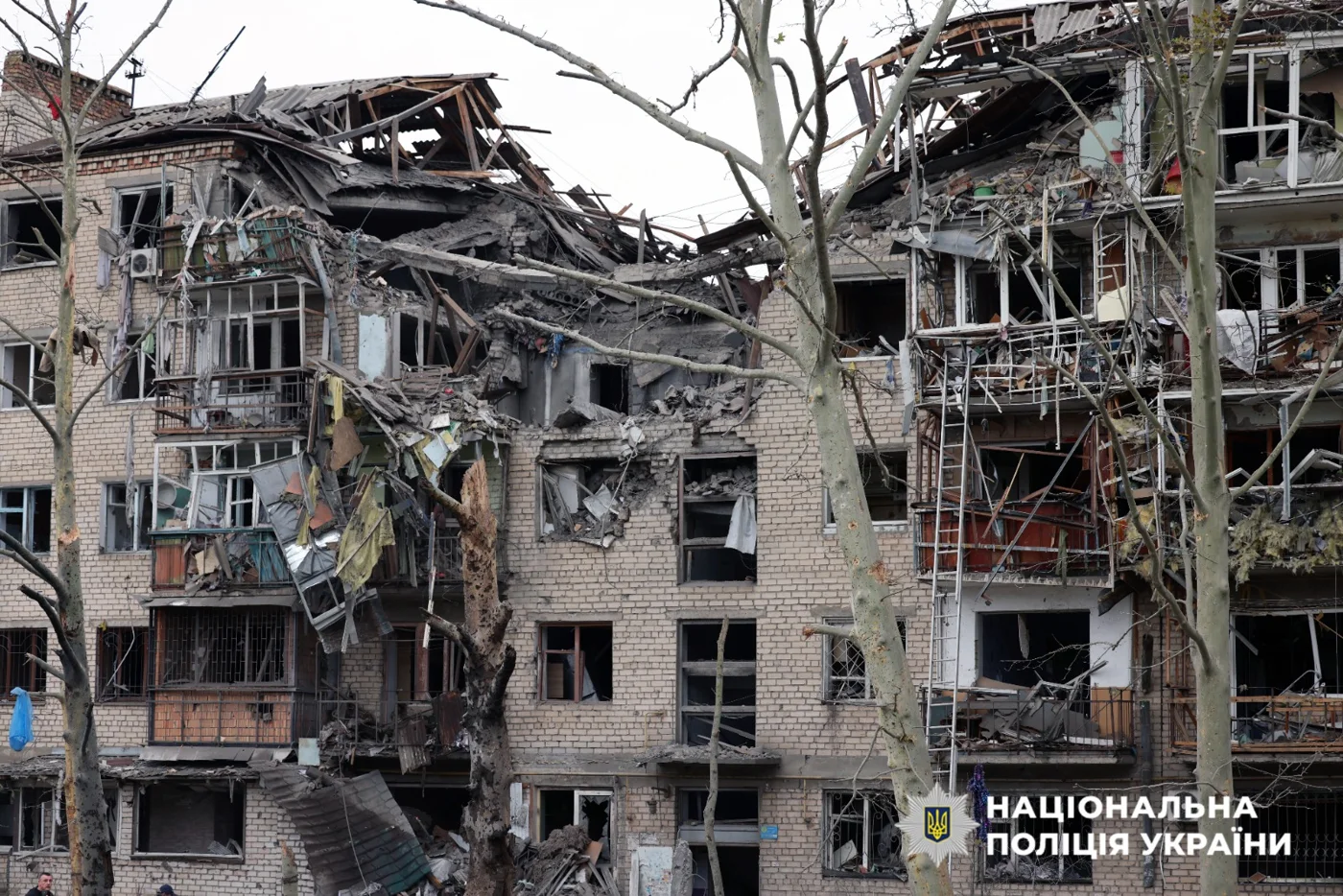Damaged apartment building in Kherson. The frame does not show people.