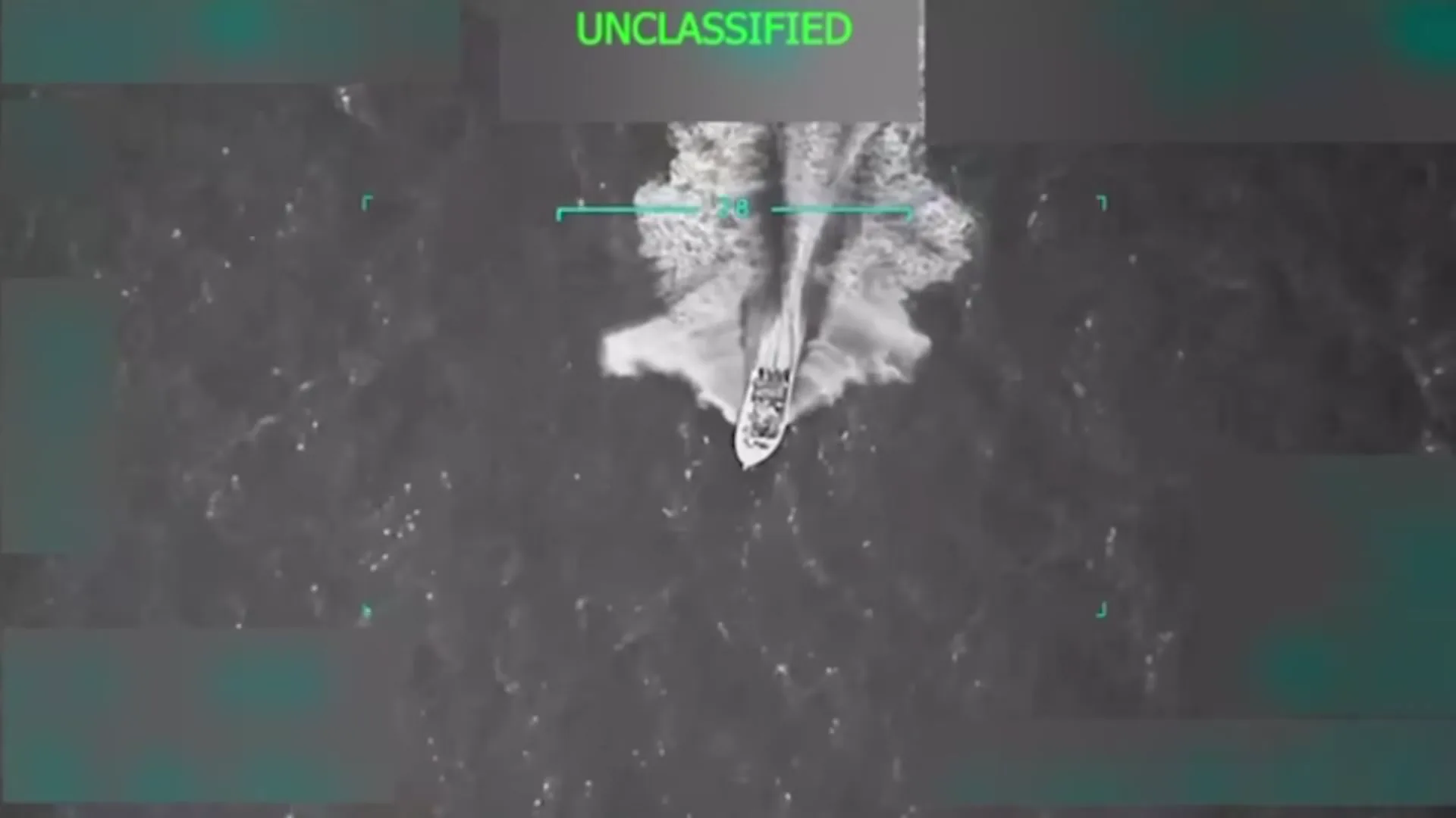 Frame at 16.8 s: wide overhead shot of the boat's wake before the strike; no people visible.
