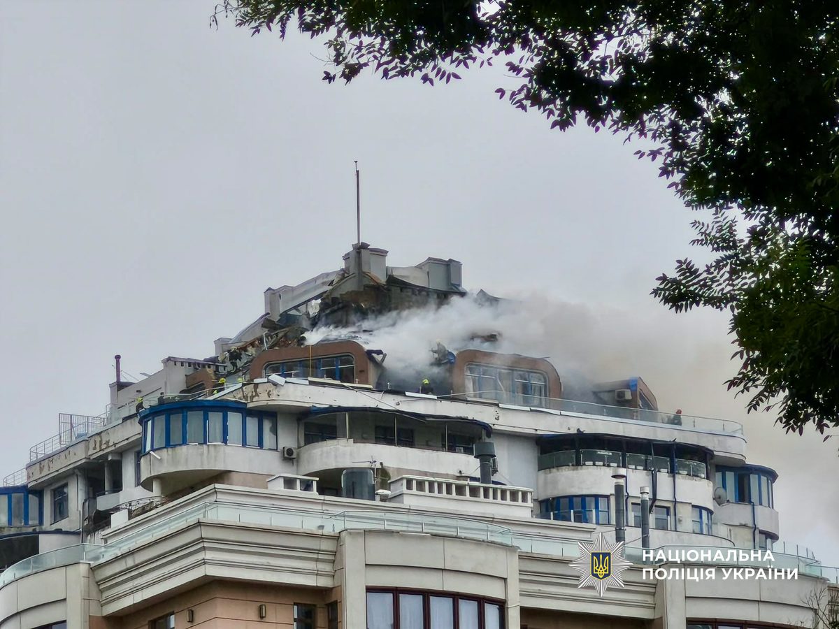 Smoke rises from the roof of the struck high-rise, Oct 18